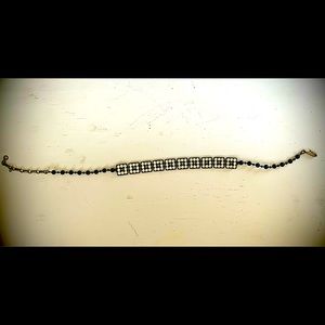 gorgeous vintage black/rhinestone choker with silver metal clasp.